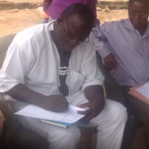 Inspecting a Soya field with Prof. Ojo (IITA)